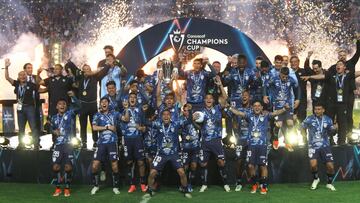 Pachuca's players celebrate with the trophy of the Concacaf Champions Cup after winning the final football match against USA's Columbus Crew at the Hidalgo stadium in Pachuca, Hidalgo State, Mexico, on June 1, 2024. (Photo by Victor Cruz / AFP)