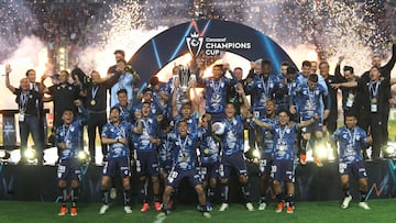 Pachuca's players celebrate with the trophy of the Concacaf Champions Cup after winning the final football match against USA's Columbus Crew at the Hidalgo stadium in Pachuca, Hidalgo State, Mexico, on June 1, 2024. (Photo by Victor Cruz / AFP)