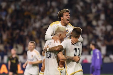 Sep 14, 2024; Carson, California, USA; Los Angeles Galaxy forward Gabriel Pec (11) celebrates goal with forward Jonathan Perez (18) and midfielder Riqui Puig (10) second half at Dignity Health Sports Park. Mandatory Credit: Kiyoshi Mio-Imagn Images