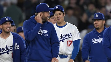 Apr 2, 2024; Los Angeles, California, USA; Los Angeles Dodgers catcher Austin Barnes (15), pitcher Clayton Kershaw (22) and designated hitter Shohei Ohtani (17) walk to the field after the final out of the ninth against the San Francisco Giants at Dodger Stadium. Mandatory Credit: Jayne Kamin-Oncea-USA TODAY Sports