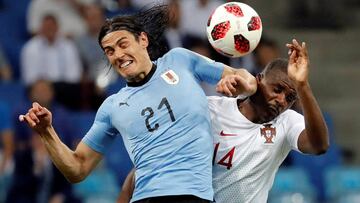 Soccer Football - World Cup - Round of 16 - Uruguay vs Portugal - Fisht Stadium, Sochi, Russia - June 30, 2018 Uruguay's Edinson Cavani in action with Portugal's William Carvalho REUTERS/Toru Hanai