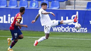 HUESCA, SPAIN - APRIL 25: Mathías Olivera of Getafe CF controls the ball during the La Liga Santander match between SD Huesca and Getafe CF at Estadio El Alcoraz on April 25, 2021 in Huesca, Spain. Sporting stadiums around Spain remain under stric