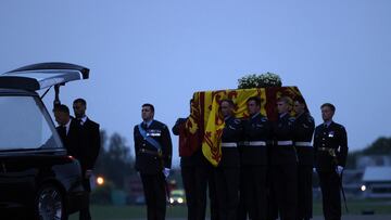 The coffin of Queen Elizabeth II is carried to the waiting hearse at RAF Northolt, from where it will be taken to Buckingham Palace, London, to lie at rest overnight in the Bow Room. Picture date: Tuesday September 13, 2022.  Jack Hill/Pool via REUTERS