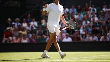 Spain's Carlos Alcaraz celebrates after winning a point against Italy's Fabio Fognini during their men's singles first round tennis match on the first day of the 2025 Wimbledon Championships at The All England Lawn Tennis and Croquet Club in Wimbledon, southwest London, on June 30, 2025. (Photo by HENRY NICHOLLS / AFP) / RESTRICTED TO EDITORIAL USE