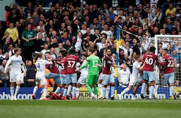 Leeds and Aston Villa players tussle after Mateusz Klich's controversial opening goal