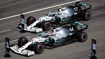 HOCKENHEIM, GERMANY - JULY 27: Lewis Hamilton of Great Britain driving the (44) Mercedes AMG Petronas F1 Team Mercedes W10 and Valtteri Bottas driving the (77) Mercedes AMG Petronas F1 Team Mercedes W10 stop in parc ferme during qualifying for the F1 Gran