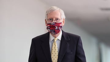 Senate Majority Leader Mitch McConnell (R-KY), wearing a mask, walks to a closed-door luncheon with fellow Republicans, on Capitol Hill in Washington, U.S. July 21, 2020. REUTERS/Tom Brenner