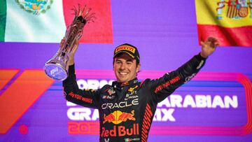 JEDDAH, SAUDI ARABIA - MARCH 19: Race winner Sergio Perez of Mexico and Oracle Red Bull Racing celebrates on the podium during the F1 Grand Prix of Saudi Arabia at Jeddah Corniche Circuit on March 19, 2023 in Jeddah, Saudi Arabia. (Photo by Ayman Yaqoob/Anadolu Agency via Getty Images)