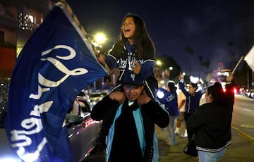 LOS ANGELES, CALIFORNIA - OCTOBER 30: Dodgers fans celebrate on Sunset Boulevard after the Los Angeles Dodgers defeated the New York Yankees in Game 5 to win the World Series against the New York Yankees on October 30, 2024 in Los Angeles, California. The Dodgers plan to hold a victory parade on Friday.   Mario Tama/Getty Images/AFP (Photo by MARIO TAMA / GETTY IMAGES NORTH AMERICA / Getty Images via AFP)