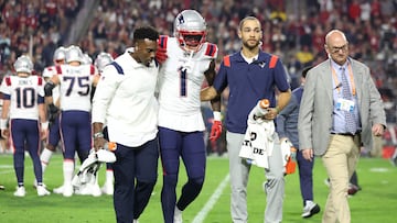 GLENDALE, ARIZONA - DECEMBER 12: DeVante Parker #1 of the New England Patriots is assisted off the field after a play against the Arizona Cardinals during the first quarter of the game at State Farm Stadium on December 12, 2022 in Glendale, Arizona.   Christian Petersen/Getty Images/AFP (Photo by Christian Petersen / GETTY IMAGES NORTH AMERICA / Getty Images via AFP)