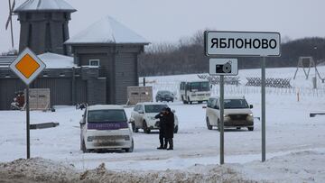 Vehicles are parked next to a road near the crash site of the Russian Ilyushin Il-76 military transport plane in the village of Yablonovo in the Belgorod region, Russia, January 25, 2024. REUTERS/Stringer