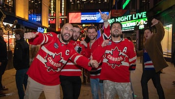 Canada fans pose outside TD Garden in Boston on February 20, 2025, during the last game of the Four Nations Face-Off ice hockey tournament between the United States and Canada. Canada defeated the USA to win the Four Nations Face-Off ice hockey title. Tensions have soared in the run-up to the tournament final in the US city of Boston following US President Donald Trump's ordering of tariffs on Canadian imports -- and his repeated verbal assaults on the sovereignty of the longtime close ally. (Photo by LAUREN OWENS LAMBERT / AFP)