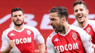 Monaco's Spanish midfielder Cesc Fabregas (2R) celebrates with teammates after scoring a goal during the French L1 football match between AS Monaco and FC Metz at the "Louis II" stadium in Monaco, on April 3, 2021. (Photo by Valery HACHE /
