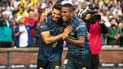 Club America's Mexican forward Henry Martin (L) and Club America's Peruvian midfielder Pedro Aquino Sanchez (R) celebrate after scoring a goal in the first half of the international friendly football match between Real Madrid and Club America at Oracle Park stadium in San Francisco, California, July 26, 2022. (Photo by CHRIS TUITE / AFP)