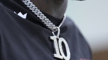 MIAMI GARDENS, FLORIDA - MARCH 24: A general view of the jewelry worn by Tyreek Hill while speaking with the media after being introduced by the Miami Dolphins at Baptist Health Training Complex on March 24, 2022 in Miami Gardens, Florida.   Mark Brown/Getty Images/AFP
== FOR NEWSPAPERS, INTERNET, TELCOS & TELEVISION USE ONLY ==