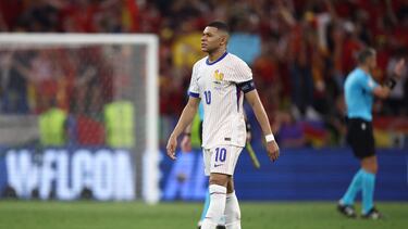 France's forward #10 Kylian Mbappe reacts after losing the UEFA Euro 2024 semi-final football match between Spain and France at the Munich Football Arena in Munich on July 9, 2024. (Photo by FRANCK FIFE / AFP)