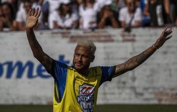 Brazilian football star Neymar celebrates after scoring during a five-a-side football tournament for his charity Neymar Junior Project Institute, in Praia Grande, Sao Paulo, Brazil, on July 13, 2019.