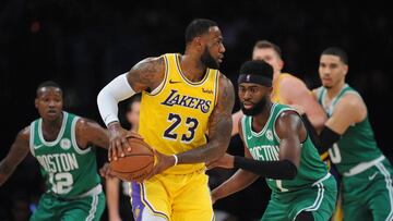 March 9, 2019; Los Angeles, CA, USA; Los Angeles Lakers forward LeBron James (23) controls the ball against Boston Celtics guard Jaylen Brown (7)  during the second half at Staples Center. Mandatory Credit: Gary A. Vasquez-USA TODAY Sports