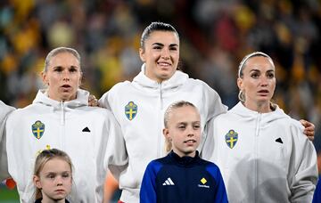 Soccer Football - FIFA Women's World Cup Australia and New Zealand 2023 - Third Place Playoff - Sweden v Australia - Brisbane Stadium, Brisbane, Australia - August 19, 2023 Sweden's Jonna Andersson, Zecira Musovic and Kosovare Asllani line up during the national anthems before the match REUTERS/Dan Peled