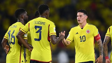 Colombia's midfielder James Rodriguez (R) celebrates with defender Jhon Lucumi (2-L) and midfielder Jefferson Lerma