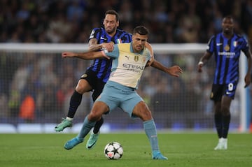 Manchester City's Rodri in action with Inter Milan's Hakan Calhanoglu 