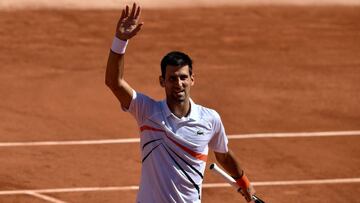 Serbia's Novak Djokovic celebrates after winning against Italy's Salvatore Caruso at the end of their men's singles third round match on day seven of The Roland Garros 2019 French Open tennis tournament in Paris on June 1, 2019. (Photo by Philippe LOPEZ / AFP)