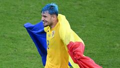 Romania's defender #02 Andrei Ratiu reacts after a draw in the  UEFA Euro 2024 Group E football match between Slovakia and Romania at the Frankfurt Arena in Frankfurt am Main on June 26, 2024. (Photo by Kirill KUDRYAVTSEV / AFP)