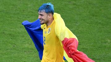 Romania's defender #02 Andrei Ratiu reacts after a draw in the  UEFA Euro 2024 Group E football match between Slovakia and Romania at the Frankfurt Arena in Frankfurt am Main on June 26, 2024. (Photo by Kirill KUDRYAVTSEV / AFP)