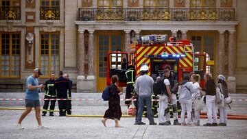 Visitors walk past as French firefighters work after a fire broke out at the Chateau de Versailles forcing the site's evacuation, but was swiftly brought under control, in Versailles, near Paris, France, June 11, 2024. REUTERS/Sarah Meyssonnier