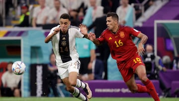 AL KHOR, QATAR - NOVEMBER 27: Jamal Musiala of Germany, Rodrigo Hernandez of Spain  during the  World Cup match between Spain  v Germany at the Al Bayt Stadium on November 27, 2022 in Al Khor Qatar (Photo by David S. Bustamante/Soccrates/Getty Images)