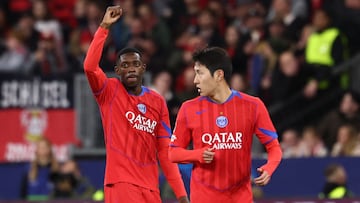 Paris Saint-Germain's French forward #10 Ousmane Dembele celebrates scoring the 2-6 goal with his teammate Paris Saint-Germain's South Korean midfielder #19 Lee Kang-in (R) during the UEFA Champions League football match between Bayer 04 Leverkusen and Paris Saint-Germain (PSG) at the BayArena stadium in Leverkusen, western Germany on October 21, 2025. (Photo by FRANCK FIFE / AFP)