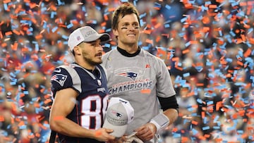 Jan 21, 2018; Foxborough, MA, USA; New England Patriots quarterback Tom Brady (right) and wide receiver Danny Amendola (80) celebrate as confetti flies after the AFC Championship Game against the Jacksonville Jaguars at Gillette Stadium. Mandatory Credit: Robert Deutsch-USA TODAY Sports
