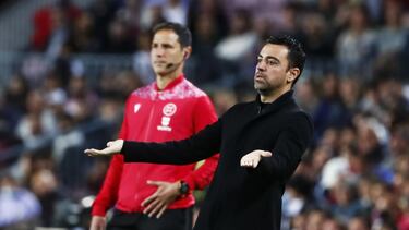 Barcelona's head coach Xavi Hernandez gestures during a Spanish La Liga soccer match between FC Barcelona and Rayo Vallecano at the Camp Nou stadium in Barcelona, Spain, Sunday, April 24, 2022. (AP Photo/Joan Monfort)