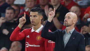 Soccer Football - Premier League - Manchester United v Liverpool - Old Trafford, Manchester, Britain - August 22, 2022 Manchester United's Cristiano Ronaldo with manager Erik ten Hag before coming on as a substitute REUTERS/Phil Noble EDITORIAL USE ONLY. No use with unauthorized audio, video, data, fixture lists, club/league logos or 'live' services. Online in-match use limited to 75 images, no video emulation. No use in betting, games or single club /league/player publications.  Please contact your account representative for further details.