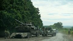 Ukrainian service members prepare to transport a Russian tank captured during a counteroffensive operation, amid Russia's attack on Ukraine, in Kharkiv region, Ukraine, in this handout picture released September 11, 2022. Press service of the Commander-in-Chief of the Armed Forces of Ukraine/Handout via REUTERS ATTENTION EDITORS - THIS IMAGE HAS BEEN SUPPLIED BY A THIRD PARTY. DO NOT OBSCURE LOGO.