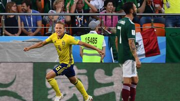 Sweden's defender Ludwig Augustinsson celebrates after scoring the opening goal during the Russia 2018 World Cup Group F football match between Mexico and Sweden at the Ekaterinburg Arena in Ekaterinburg on June 27, 2018. / AFP PHOTO / Anne-Christine