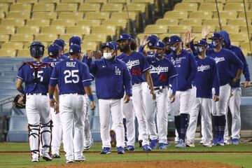 LOS ANGELES, CALIFORNIA - MARCH 30: The Los Angeles Dodgers celebrate their 6-4 win over the Los Angeles Angels on March 30, 2021 in Los Angeles, California.