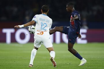 Paris Saint-Germain's Ousmane Dembélé and Marseille's Renan Lodi in action during the Ligue 1 match between Paris Saint-Germain and Olympique de Marseille on 24 September 2023.
