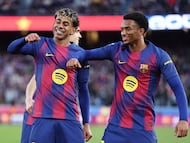Barcelona's Spanish forward #10 Lamine Yamal celebrates scoring his team's second goal with Barcelona's Spanish defender #03 Alex Balde (R) during the Spanish league football match between FC Barcelona and RCD Mallorca at Camp Nou Stadium in Barcelona on February 7, 2026. (Photo by Josep LAGO / AFP)