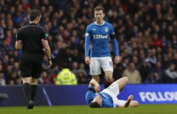 Britain Football Soccer - Rangers v Celtic - Scottish Premiership - Ibrox Stadium - 31/12/16 Rangers' Clint Hill down on the pitch as Andy Halliday  looks on  