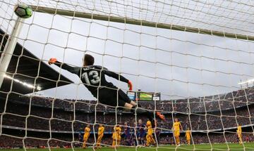 Barcelona’s Lionel Messi scores their first goal from a free kick