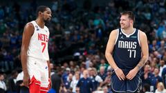 Dallas Mavericks guard Luka Doncic (77) laughs with Brooklyn Nets forward Kevin Durant (7) during the fourth quarter at American Airlines Center.