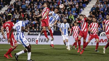 Marc Muniesa (Girona FC)  wins the header from Guido Carrillo (CD Leganes),   La Liga match between CD Leganes vs Girona FC at the Municipal de Butarque stadium in Madrid, Spain, March 16, 2019 .