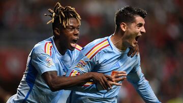 Spain's forward Alvaro Morata (R) celebrates with Spain's midfielder Nico Williams after scoring his team first goal during the UEFA Nations League, league A, group 2 football match between Portugal and Spain, at the Municipal Stadium in Braga on September 27, 2022. - Spain won 0-1. (Photo by MIGUEL RIOPA / AFP)