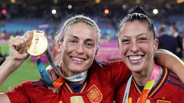 (FILES) Spain's midfielder #11 Alexia Putellas (L) and Spain's midfielder #10 Jennifer Hermoso celebrate their victory during the Australia and New Zealand 2023 Women's World Cup final football match between Spain and England at Stadium Australia in Sydney on August 20, 2023. The star of Spain's women's team, Alexia Putellas, described federation president Luis Rubiales' behaviour as "unacceptable" on August 25, 2023 after he refused to resign from his post following his kiss on the lips of a World Cup player. (Photo by FRANCK FIFE / AFP)