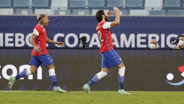 Chile's Ben Brereton, right, celebrates scoring his side's opening goal against Bolivia during a Copa America soccer match at Arena Pantanal stadium in Cuiaba, Brazil, Friday, June 18, 2021. (AP Photo/Andre Penner)