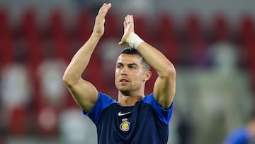 Nassr's Portuguese forward #07 Cristiano Ronaldo greets the fans ahead of the Saudi Pro League football match between Al-Ittihad and Al-Nassr at King Abdullah Sports City Stadium in Jeddah on December 26, 2023. (Photo by AFP)