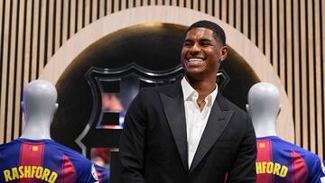 English forward Marcus Rashford who joined Barcelona on loan from Manchester United smiles during his official presentation at the Camp Nou stadium in Barcelona on July 23, 2025. Barcelona and Manchester United have reached a deal for the loan of the player Marcus Rashford until June 30, 2026," announced the La Liga champions in a statement. (Photo by Josep LAGO / AFP)