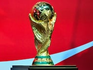 The FIFA World Cup Trophy is displayed during the Los Angeles stop of The FIFA World Cup 26 Trophy Tour by Coca-Cola at LA Live in Los Angeles on March 24, 2026. (Photo by Frederic J. Brown / AFP)
