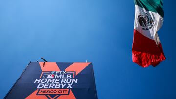 MEXICO CITY, MEXICO - OCTOBER 15: The Mexican flag waves next to the FTX MLB Home Run Derby X logo during the FTX MLB Home Run Derby X at Campo Marte on October 15, 2022 in Mexico City, Mexico.   Hector Vivas/Getty Images/AFP